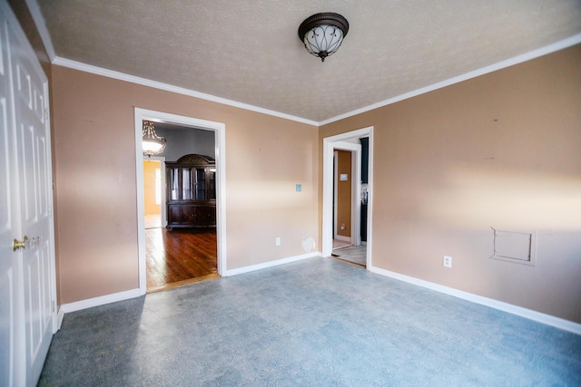 unfurnished room featuring baseboards, a textured ceiling, concrete flooring, and crown molding