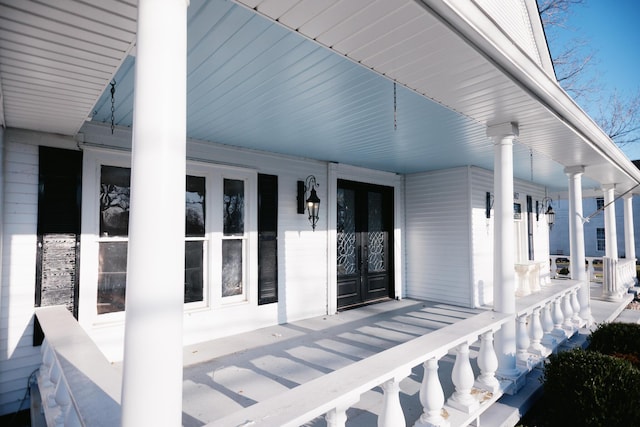 view of patio / terrace featuring french doors and covered porch