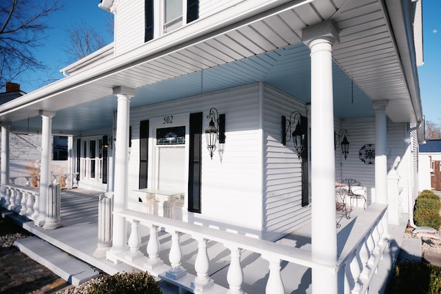 view of exterior entry with covered porch