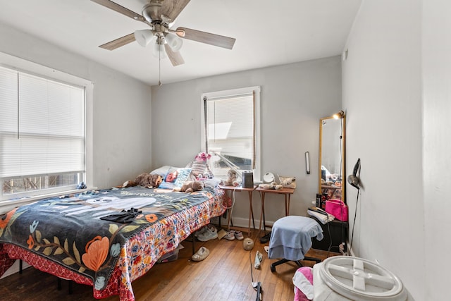 bedroom with a ceiling fan and hardwood / wood-style floors