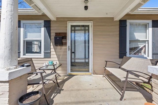 property entrance featuring covered porch