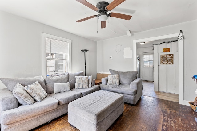 living room with wood-type flooring and ceiling fan