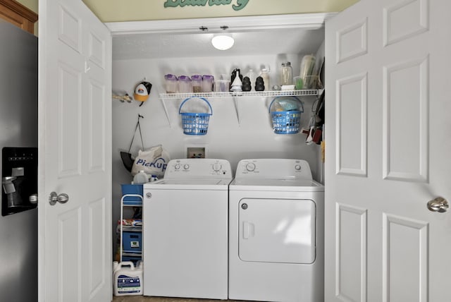 washroom featuring laundry area and independent washer and dryer