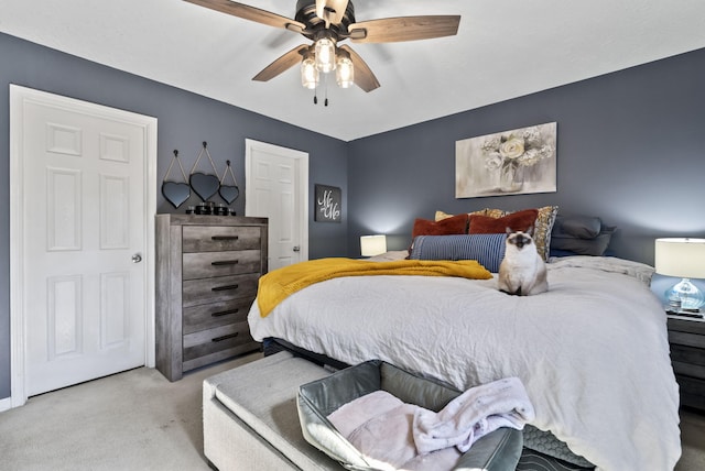 carpeted bedroom with a ceiling fan