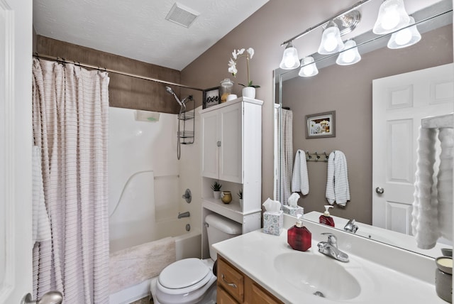 bathroom featuring vanity, visible vents, shower / bath combination with curtain, a textured ceiling, and toilet