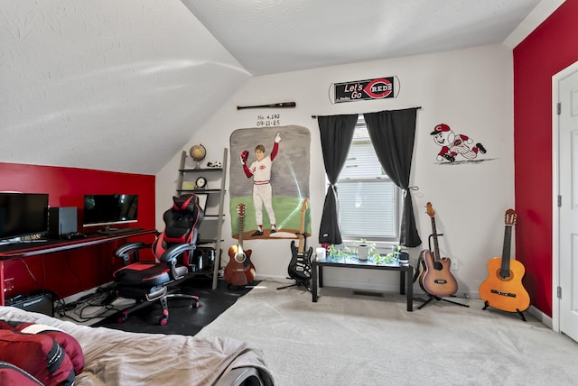 carpeted bedroom featuring a textured ceiling, baseboards, and lofted ceiling