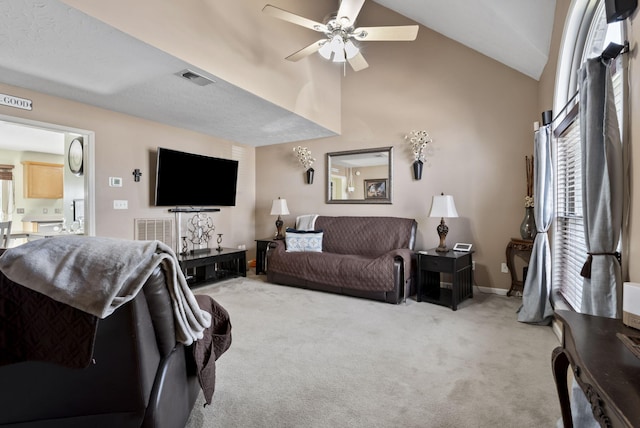 living room with a ceiling fan, light colored carpet, visible vents, and baseboards