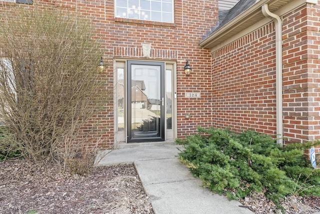 property entrance with brick siding