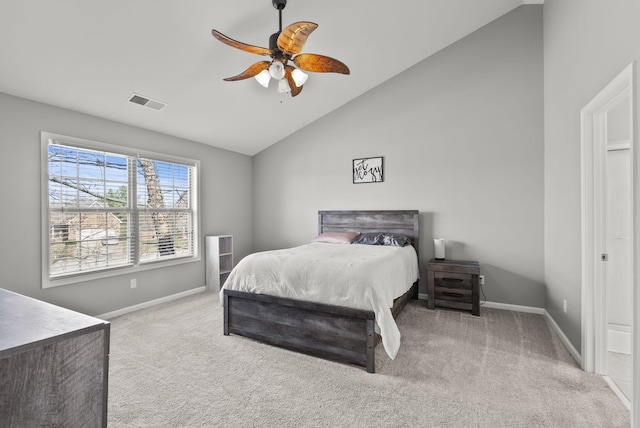 bedroom with vaulted ceiling, baseboards, visible vents, and carpet floors