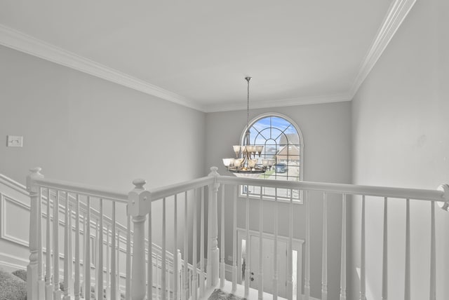 interior space featuring ornamental molding and a chandelier