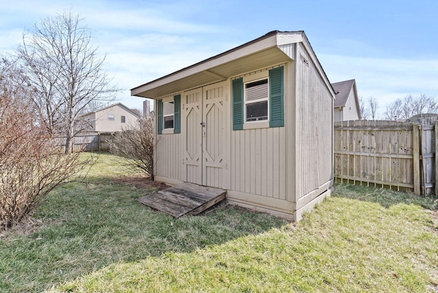 view of outbuilding featuring a fenced backyard and an outdoor structure