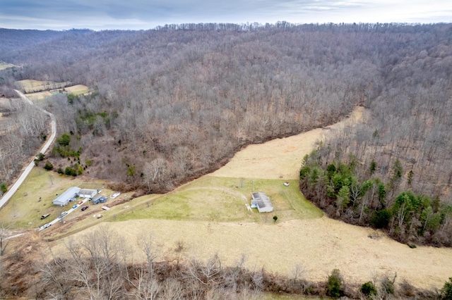 birds eye view of property featuring a rural view and a forest view