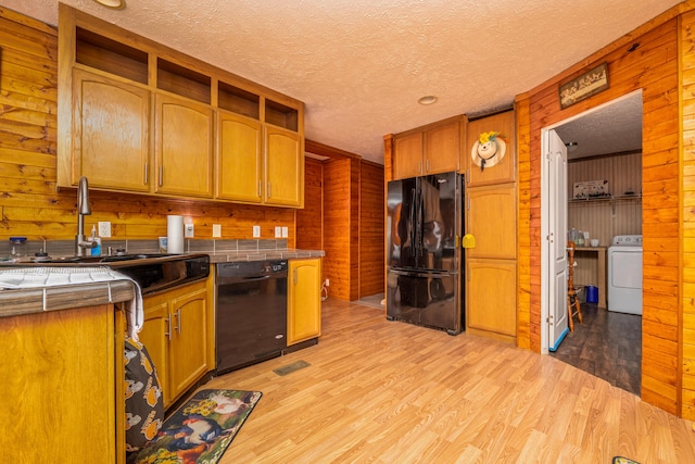 corridor featuring dark wood-type flooring, a textured ceiling, and ornamental molding