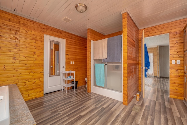 misc room with visible vents, wood ceiling, and wood finished floors