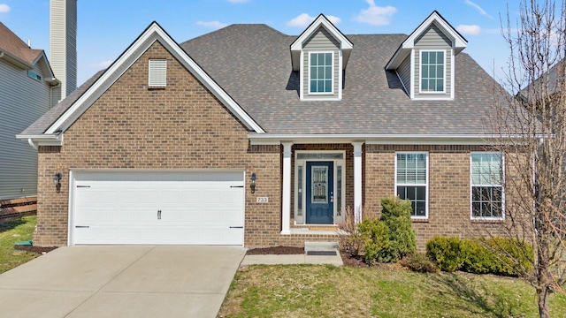 view of front of property with driveway, brick siding, roof with shingles, and an attached garage