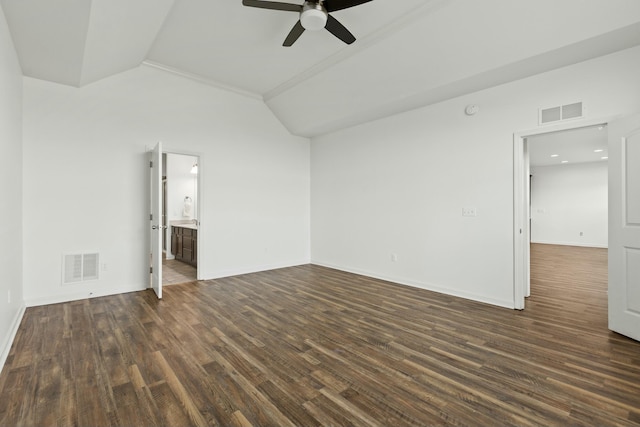 unfurnished room with dark wood finished floors, visible vents, baseboards, and lofted ceiling