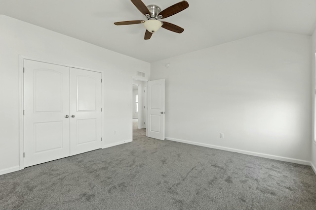 unfurnished bedroom featuring visible vents, carpet, a closet, and baseboards