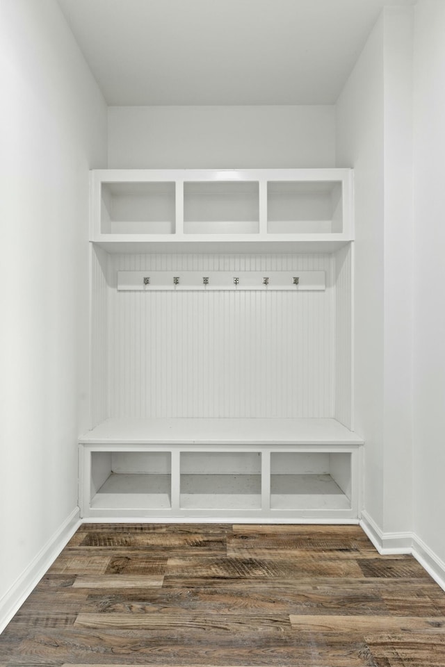 mudroom featuring dark wood-style floors and baseboards