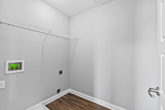 clothes washing area featuring dark wood-type flooring, baseboards, hookup for an electric dryer, hookup for a washing machine, and laundry area