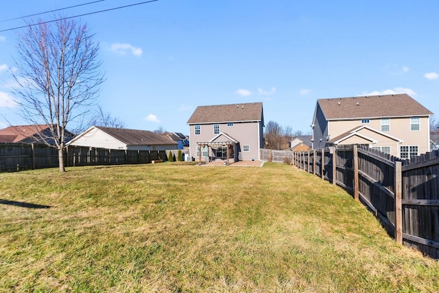 view of yard featuring a patio area and a fenced backyard