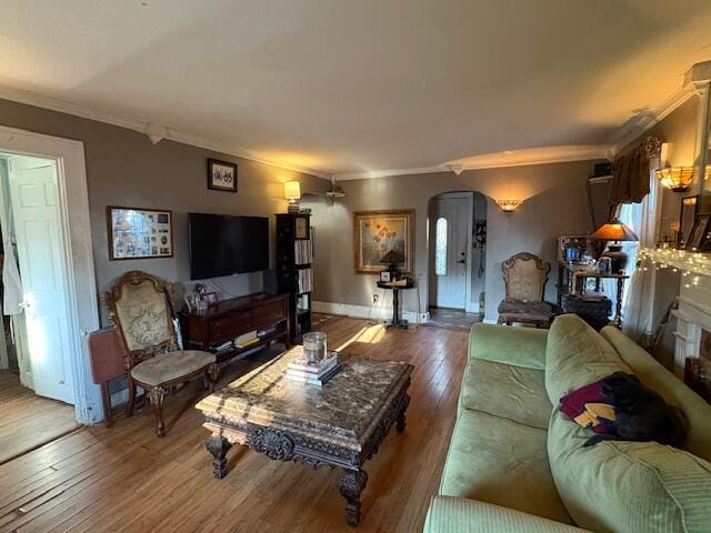 108 Linden Ave, Frankfort, KY 40601 - living room with baseboards, arched walkways, ornamental molding, and hardwood / wood-style floors