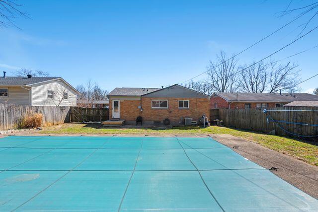 view of swimming pool with a fenced backyard and a fenced in pool