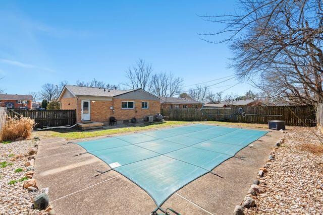 view of pool with a fenced in pool, a fenced backyard, and a patio area