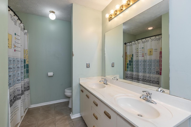 full bathroom featuring tile patterned flooring, a textured ceiling, toilet, and a sink