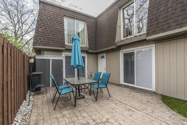 view of patio featuring outdoor dining area and a fenced backyard