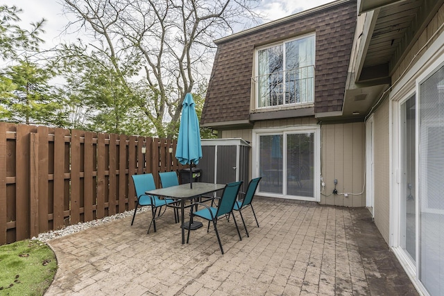 view of patio / terrace with outdoor dining area and fence