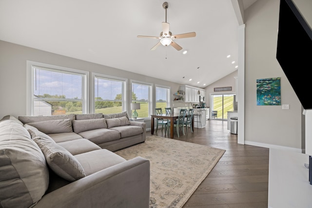 living room with dark wood-type flooring, baseboards, ceiling fan, recessed lighting, and high vaulted ceiling