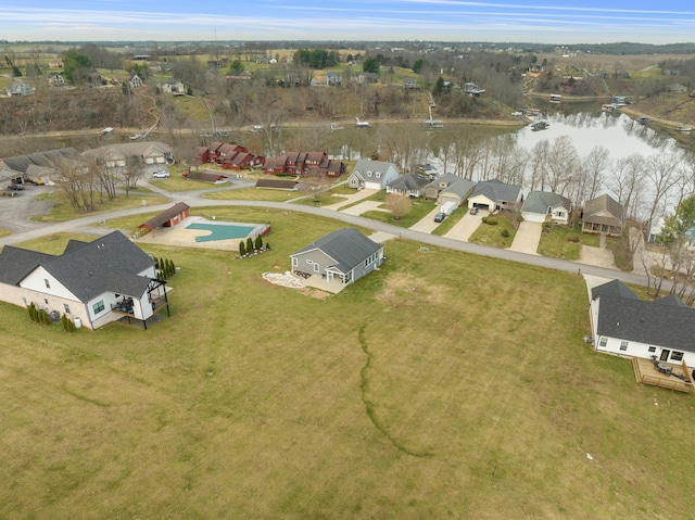 bird's eye view with a residential view and a water view