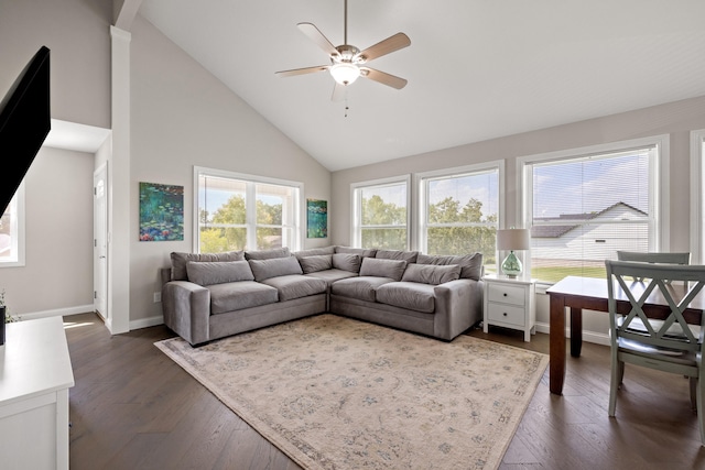 living room featuring dark wood finished floors, high vaulted ceiling, baseboards, and ceiling fan