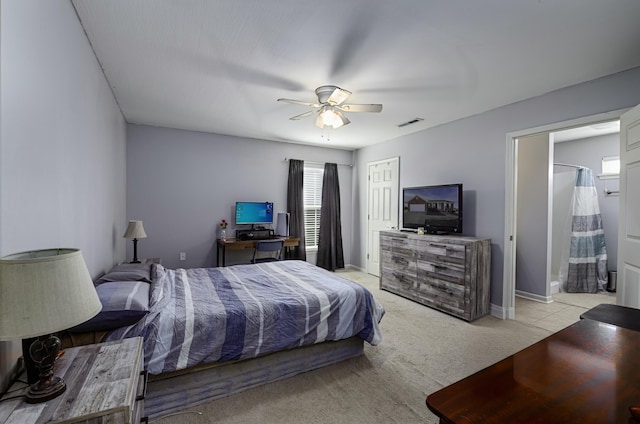 bedroom with a ceiling fan, visible vents, baseboards, a closet, and light colored carpet