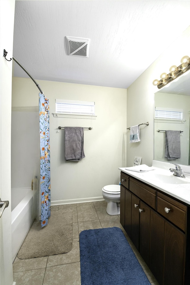 bathroom with tile patterned floors, visible vents, toilet, baseboards, and vanity