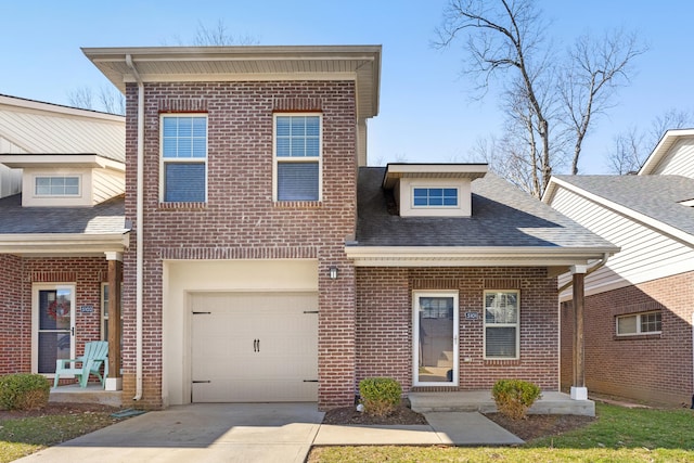 view of front of property with concrete driveway, an attached garage, brick siding, and a shingled roof