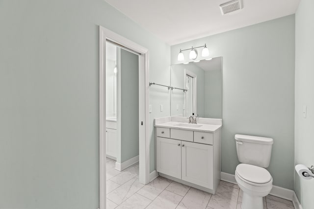 bathroom featuring visible vents, marble finish floor, and baseboards