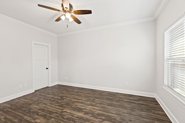 unfurnished room with dark wood finished floors, a healthy amount of sunlight, crown molding, and a ceiling fan