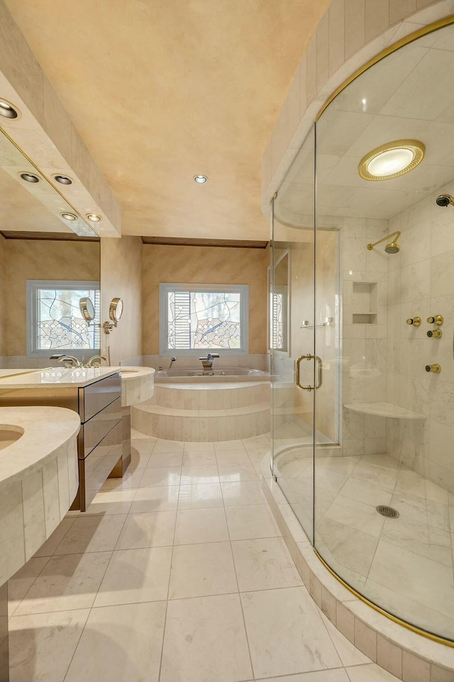 full bath featuring a stall shower, vanity, and a garden tub