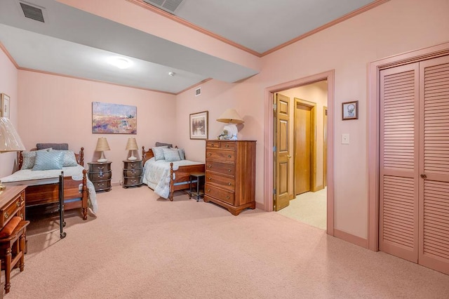 bedroom featuring visible vents, carpet floors, and ornamental molding