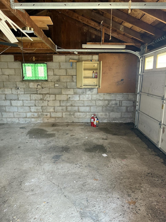 garage with concrete block wall