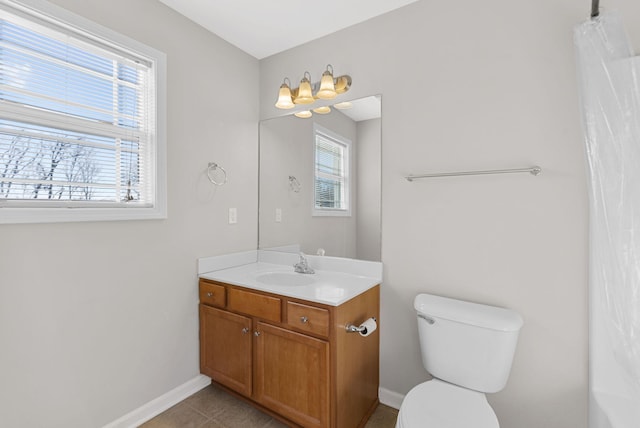 full bathroom with tile patterned floors, toilet, vanity, and baseboards