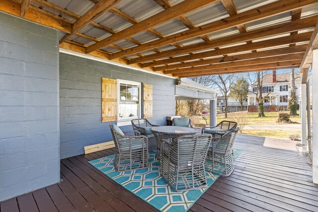 wooden deck featuring outdoor dining area