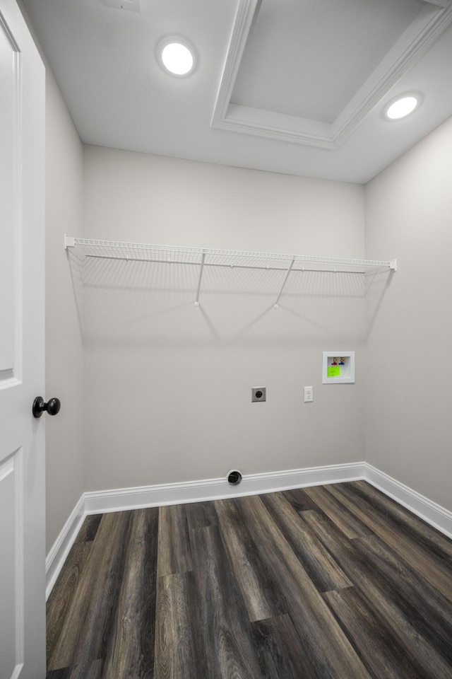 laundry area with baseboards, hookup for an electric dryer, dark wood-style flooring, and laundry area