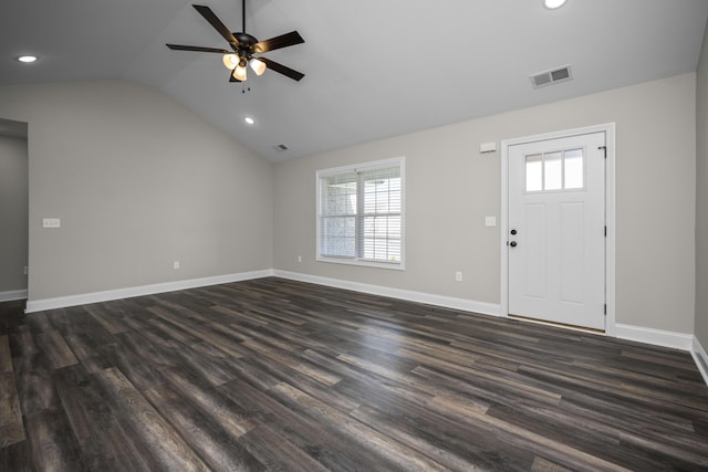 entrance foyer featuring dark wood finished floors, visible vents, a healthy amount of sunlight, and lofted ceiling