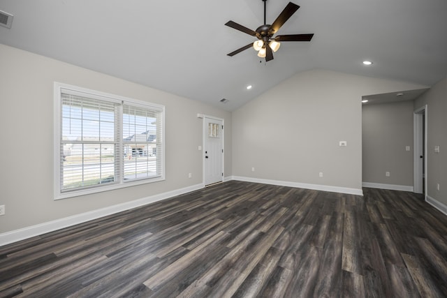 unfurnished living room with visible vents, dark wood-type flooring, baseboards, and vaulted ceiling