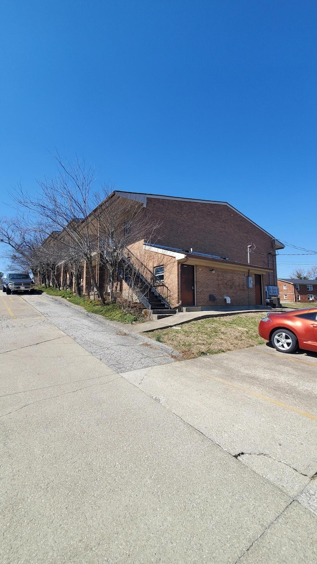 view of front of home with brick siding