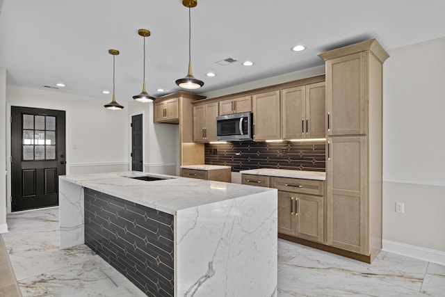 kitchen featuring stainless steel microwave, visible vents, decorative backsplash, recessed lighting, and marble finish floor