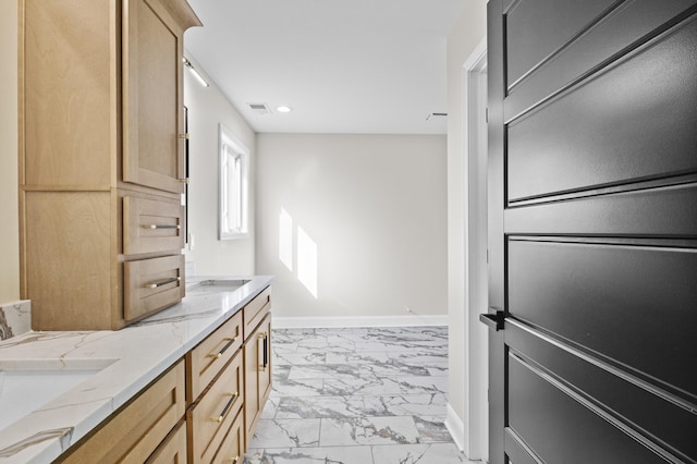 bathroom with baseboards, visible vents, double vanity, recessed lighting, and marble finish floor