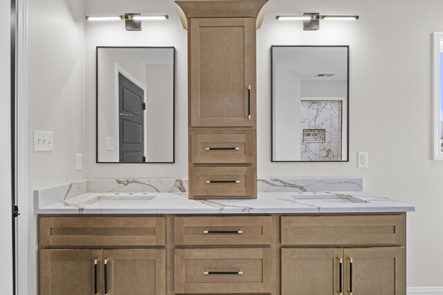 full bath featuring a sink, visible vents, and double vanity